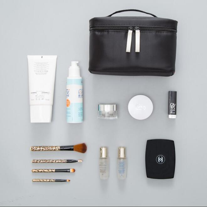 Capacious handheld cosmetic bag