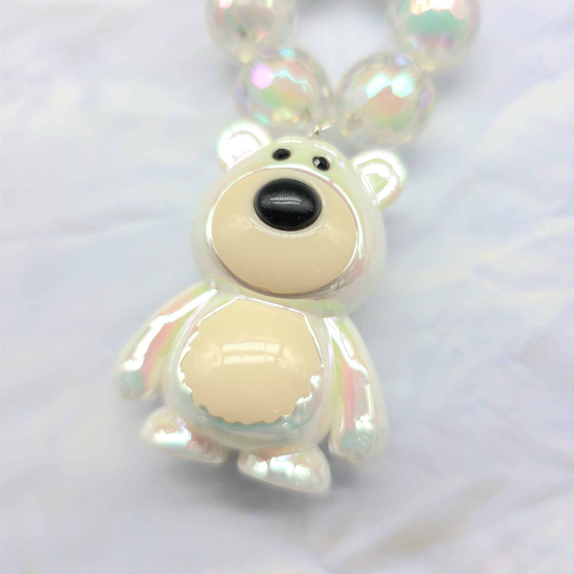 2023 nuevo llavero de cadena de cuentas redondas colgante de oso Cadena de teléfono móvil colorido fresco perla accesorios de color sólido auricular