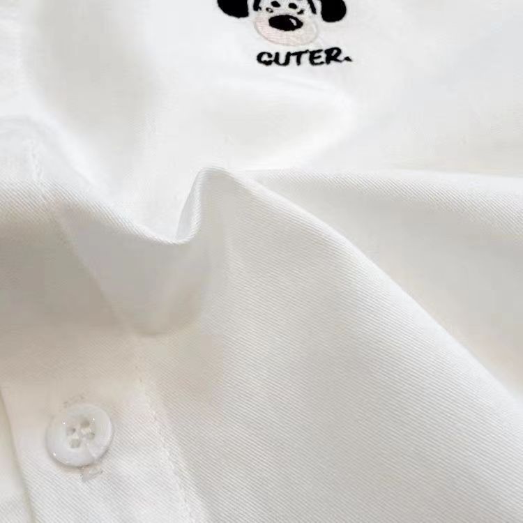 Camisas de mangas largas de algodón para niños bordados de estilo extranjero versátiles 2025 otoño primavera y otoño camisa blanca con solapa