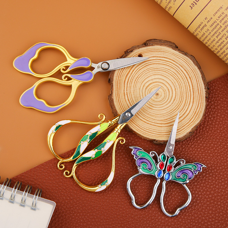 Painted multicoloured handheld scissors for traveling