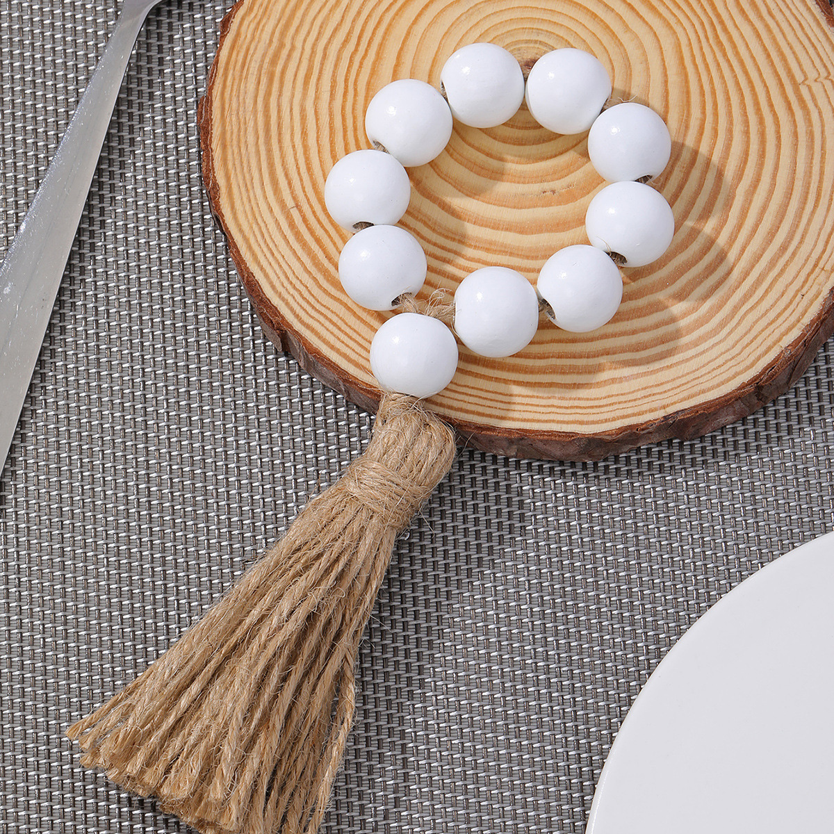 Amazon cuentas de madera borla servilleta anillo pastoral estilo registro servilleta hebilla tejida a mano cuerda de cáñamo servilleta anillo de tela de boca