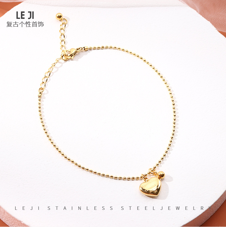 JL-0118: oro elegante con un corazón y una cuenta