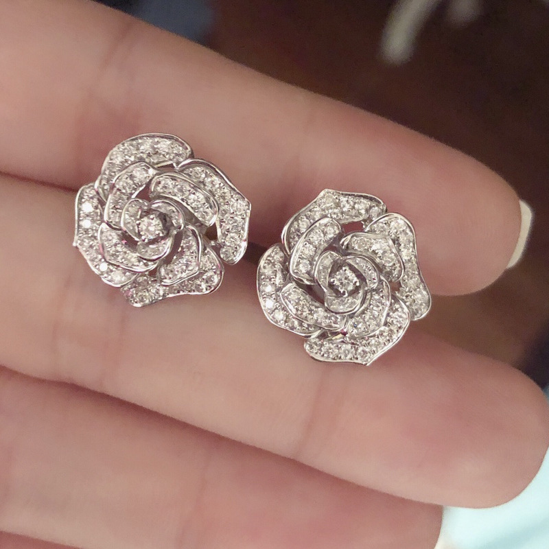 Retro Hollowed Flower Shaped Inlaid Zircon Copper Earrings Wholesale display picture 2