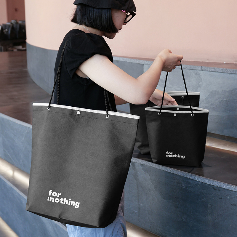 2026感无纺布手提袋包边按扣无纺布袋服装店打包衣服袋子马年