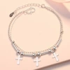Three cross bracelets