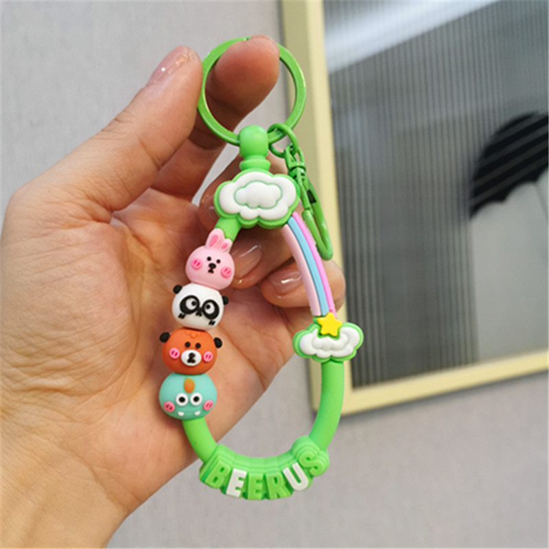 Colorido Berus dibujos animados cuerda Rana conejo llavero colgante Cadena de teléfono móvil fresco color sólido conjunto auriculares