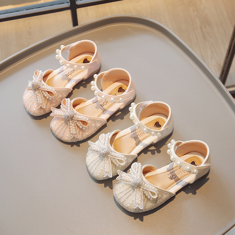 Zapatos de cristal para niñas 2026 verano nuevas sandalias de cabeza de bolsillo para niños pequeños zapatos de princesa suaves zapatos de baile de niñas