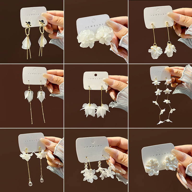White elegant transparent earrings pearl with tassels