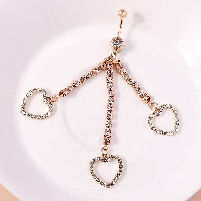 Piercing de nombril cœur avec chaîne en diamant et griffe_voghion.com