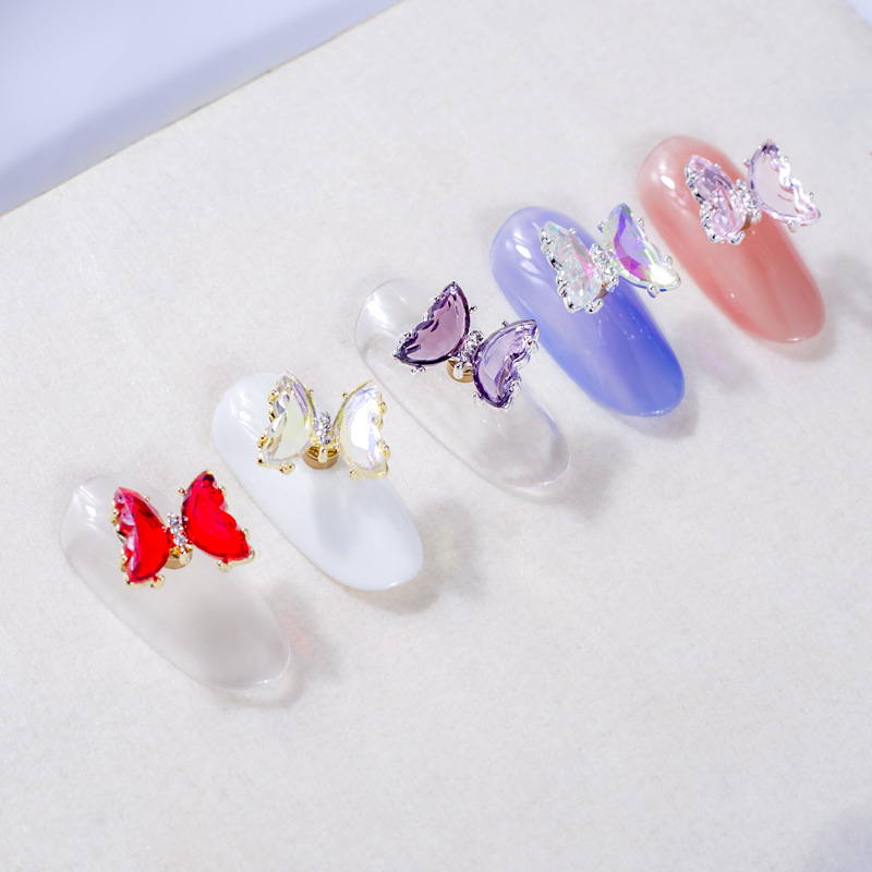 Giratoria de uñas mariposa joyería en línea celebridad tridimensional Rosa cristal alas accesorios DIY mariposa joyería de uñas Taladro