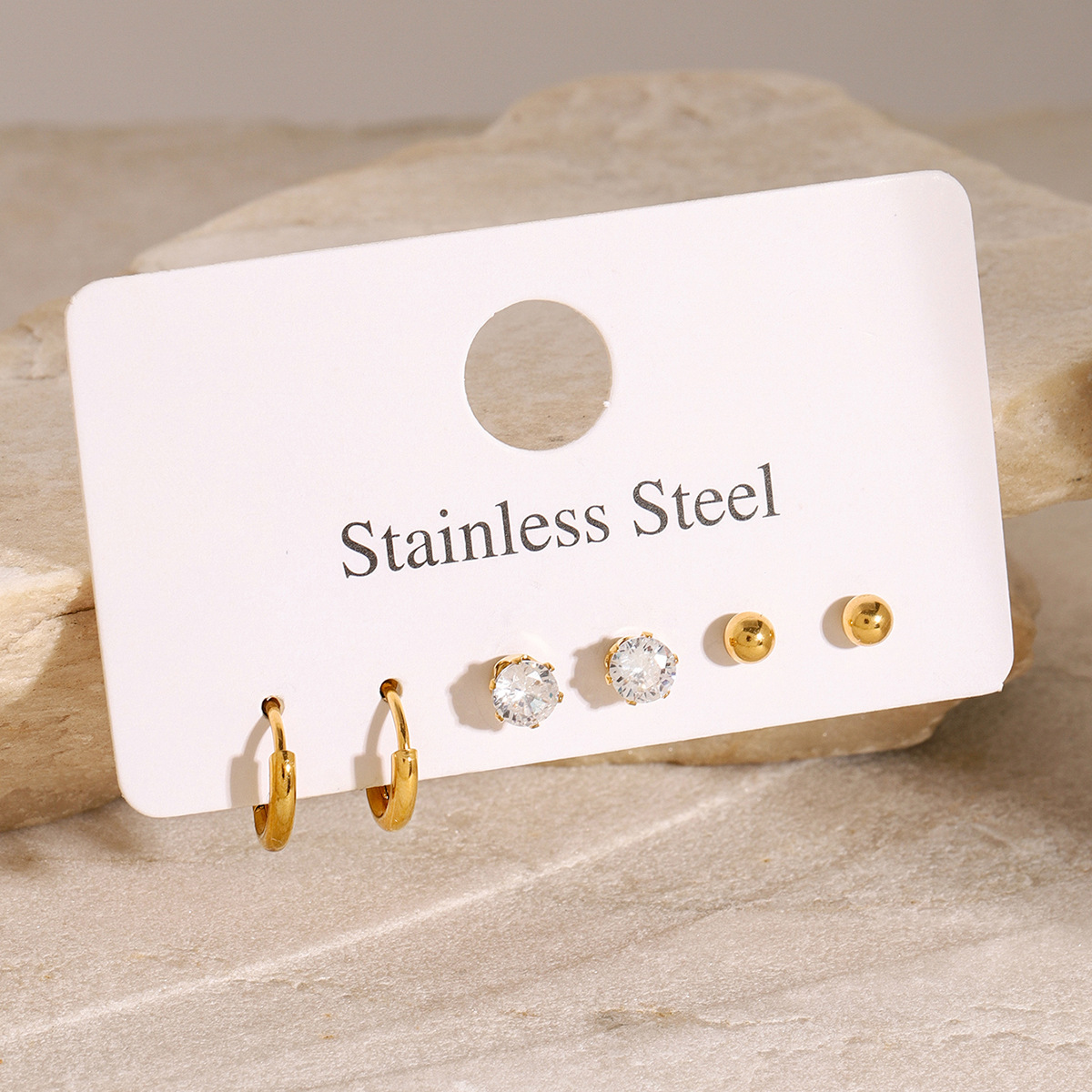 Wanxing Europa y América acero inoxidable tres a uno conjunto de zircon anillo simple pernos de orejas pendientes de acero de titanio simple joyas transfronterizas