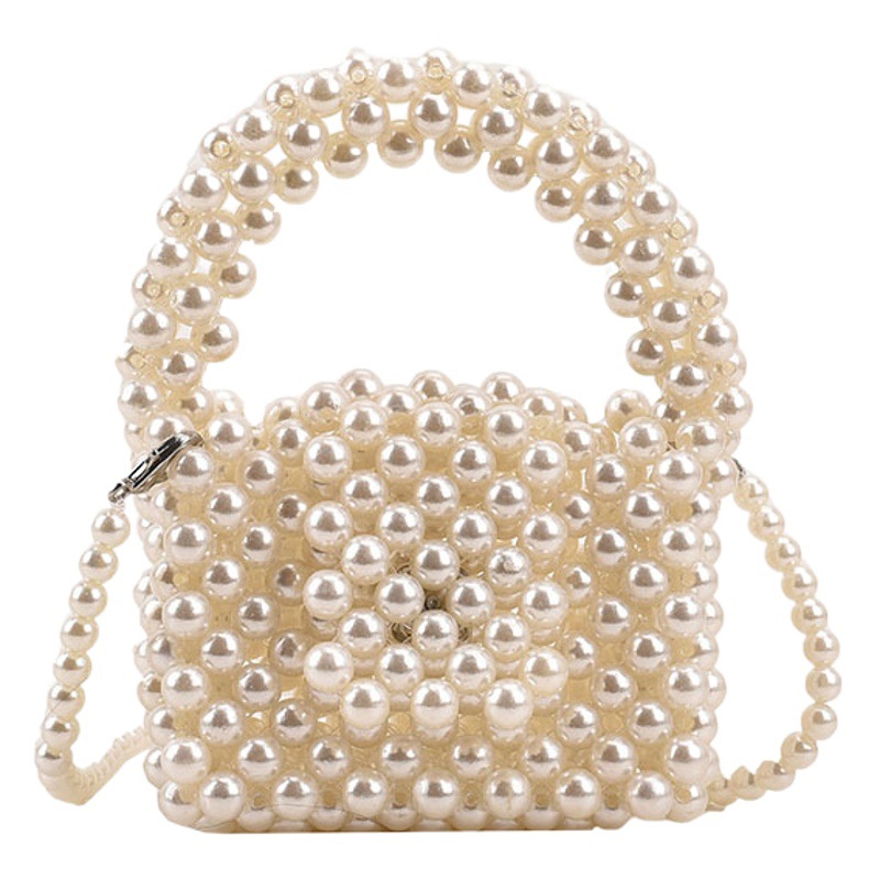 Bolsa de perlas portátil para niñas 2023 nueva pequeña princesa tejida a mano bolsa de mensajero bolsa de accesorios de cambio de bebé mini
