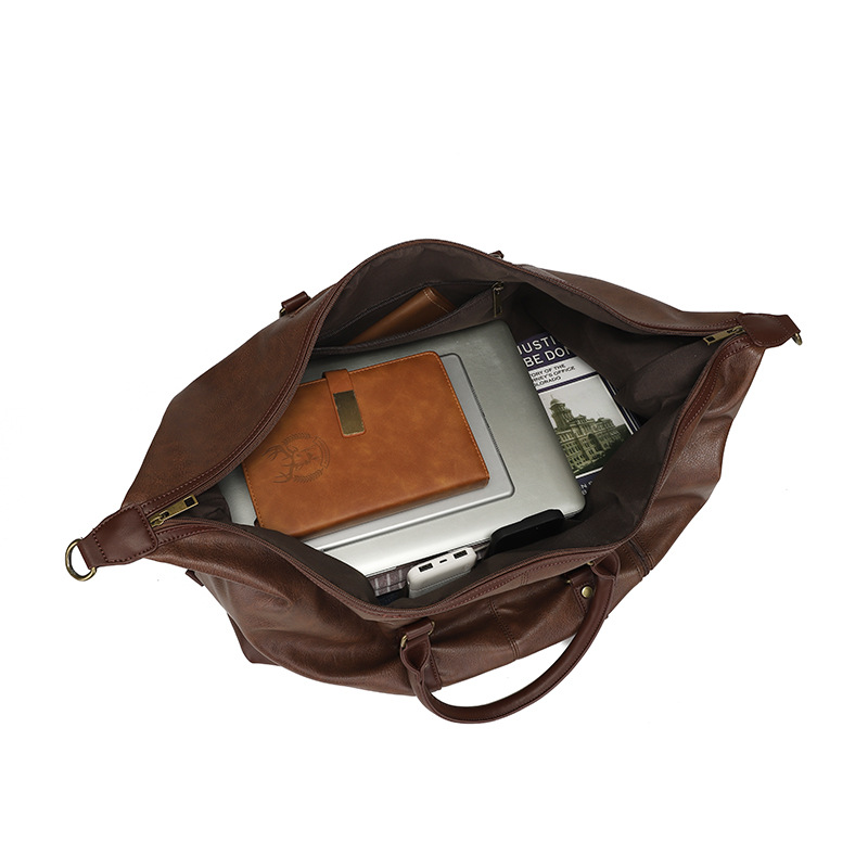 Fuente de la fábrica Nueva bolsa de viaje de PU resistente al desgaste estilo de negocios de color sólido hombro al aire libre bolsa de equipaje bolsa de almacenamiento explosión transfronteriza