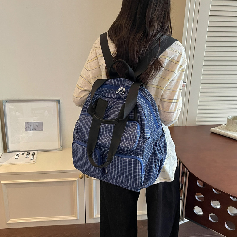 2026 nueva mochila de gran capacidad de viaje mochila de moda coreana multifuncional empalme día de nylon color contrastante