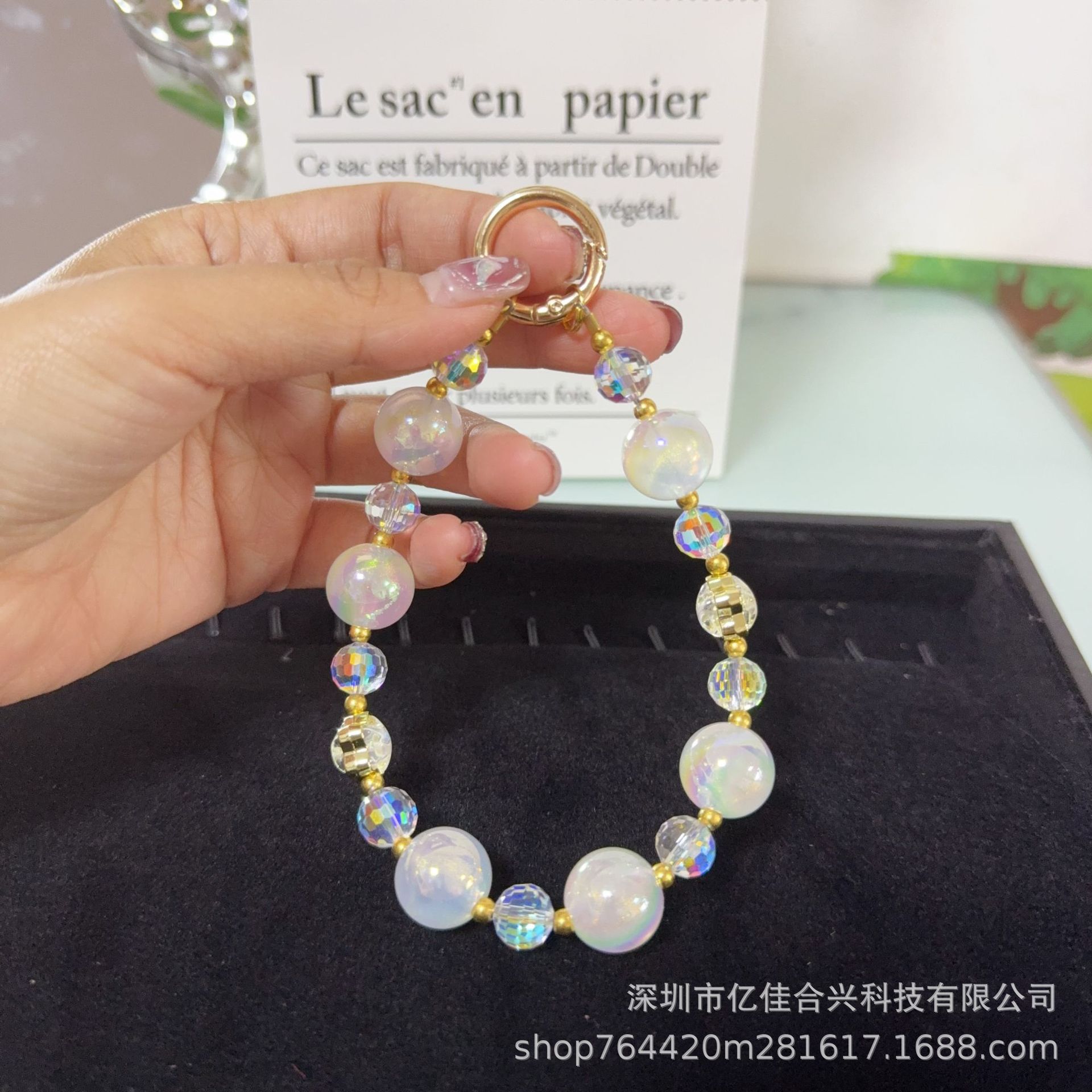 Mayorista cadena de teléfonos móviles sensación de alta calidad estereoscópica bola pentagonal llave colgante perla de teléfono móvil colgante pulsera nuevo