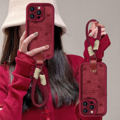 蝶結びのストラップ付き、Apple 15 Pro、14、13、17、16対応のシリコン製羊革風スマホケース、精密な穴あけ加工で落下防止、新年向け