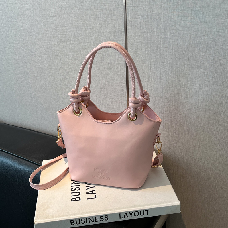 2025 nuevo bolso pequeño de estilo occidental simple y popular bolso de mensajero de moda de verano femenino bolso de cubo portátil casual