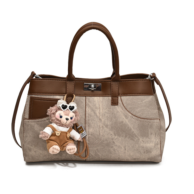 Bolso de mano retro de otoño y invierno para mujeres 2025 nuevo estilo de alta calidad de la bolsa de transporte de viaje empalmado bolso de hombro