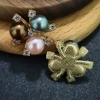 Three color pearls on gold