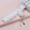 White lace ribbon + snowflake pom-pom