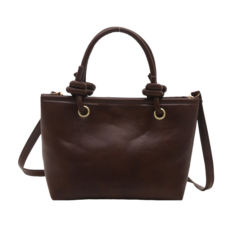 Bolso de moda simple 2024 invierno nuevo estilo retro textura bolso de cubo de moda color sólido viaje mochila de hombro