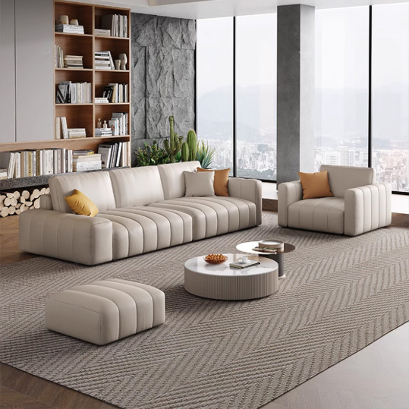 Estilo italiano Luz de lujo estilo crema primera capa de sofá de piel de vaca apartamento grande y pequeño abajo esponja suave cubierta de acero piano clave sofá de cuero