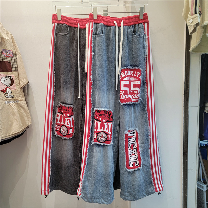 2026 primavera y verano nuevo estilo americano estilo callejero retro empalme jeans letras sueltas pegatinas pantalones largos de pierna ancha