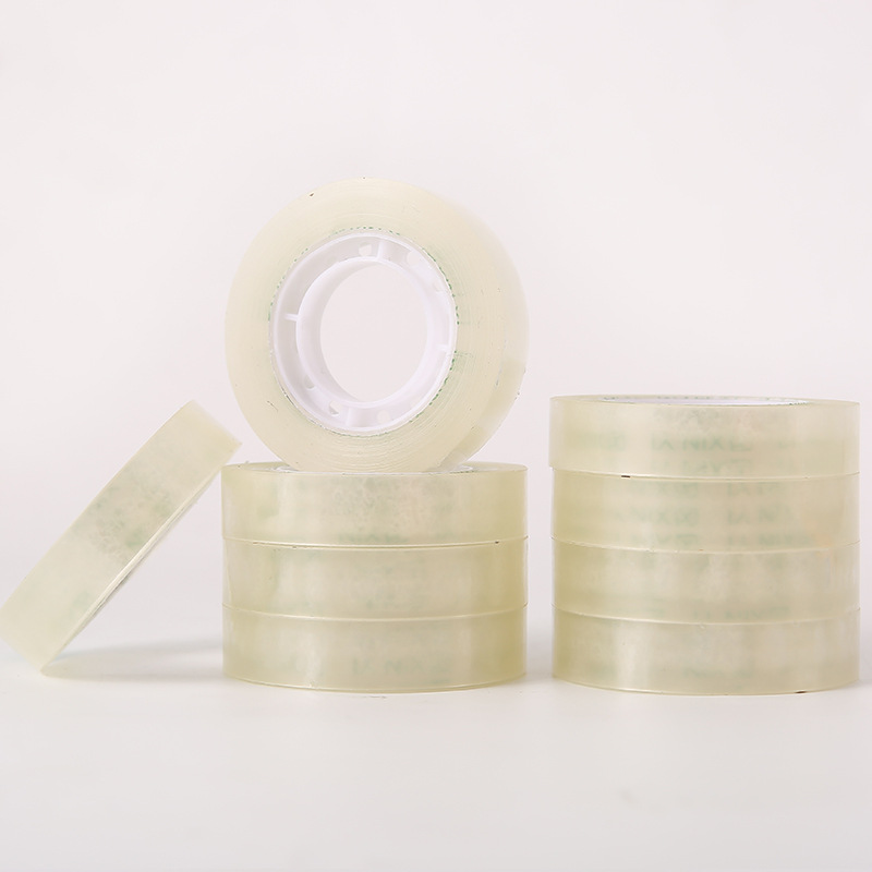 Cerca de 18 metros de largo 1,0 cm de ancho de diámetro 4,9 cm cinta de papelería súper transparente adhesivo estudiante pequeña cinta al por mayor