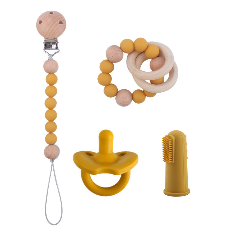 Nuevo bebé suministros de silicona de cuatro piezas conjunto chupete bebé silicona pezón pulsera dedo manga cepillo de dientes pezón cadena