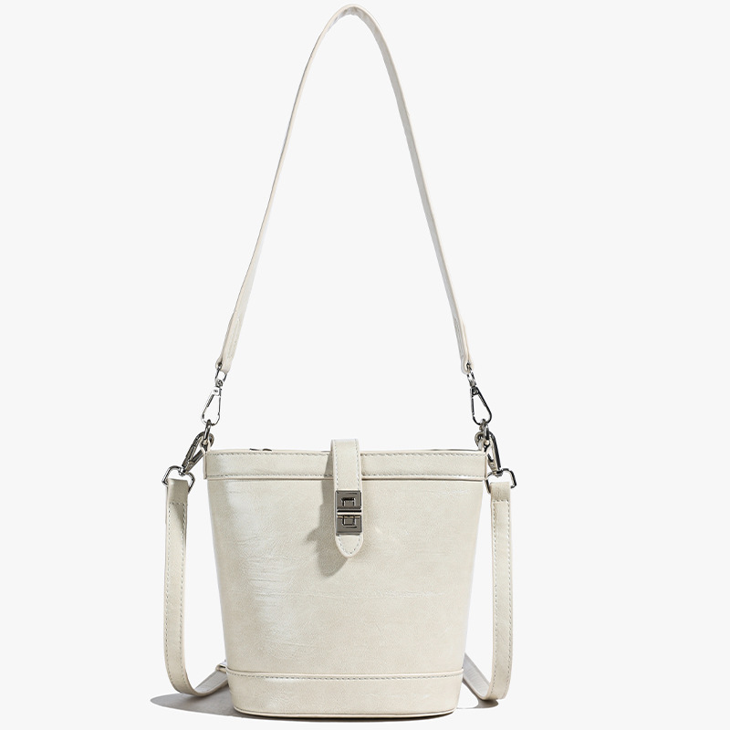 Moda simple bolso de cubo portátil mujer 2025 nuevo estilo versátil retro bolso de hombro casual alta sensación de mochila
