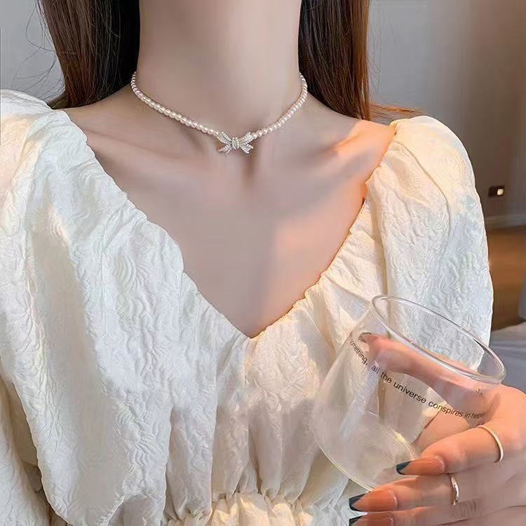 国境を越えた売れ筋のファッショナブルな新しいパールリボンペンダントネックレスイヤリングセット女性のニッチデザイン多用途アクセサリー|undefined