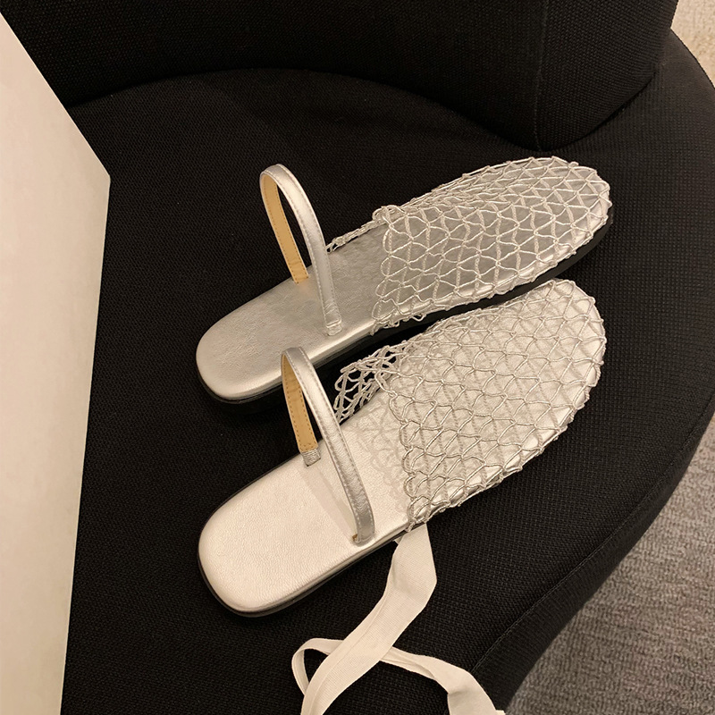 Grava Madre verano nuevo estilo de moda de pan de red hueco con playa de mitad zapatillas de fondo plano para mujeres de verano