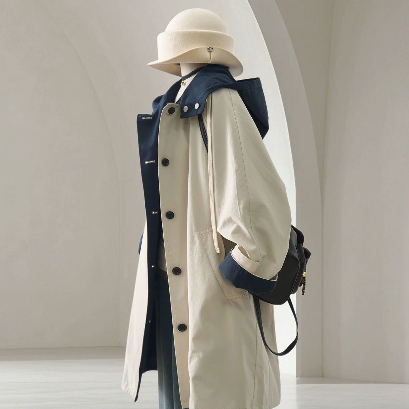 Cream-colored Korean-style reversible hooded trench coat for women, perfect for autumn, with a trendy color-block design