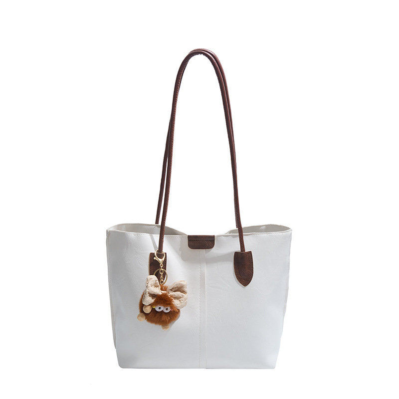 Moda de gran capacidad de la cara suave 2025 primavera nuevo colgante de ocio retro color sólido simple bolso de hombro axilar de mano