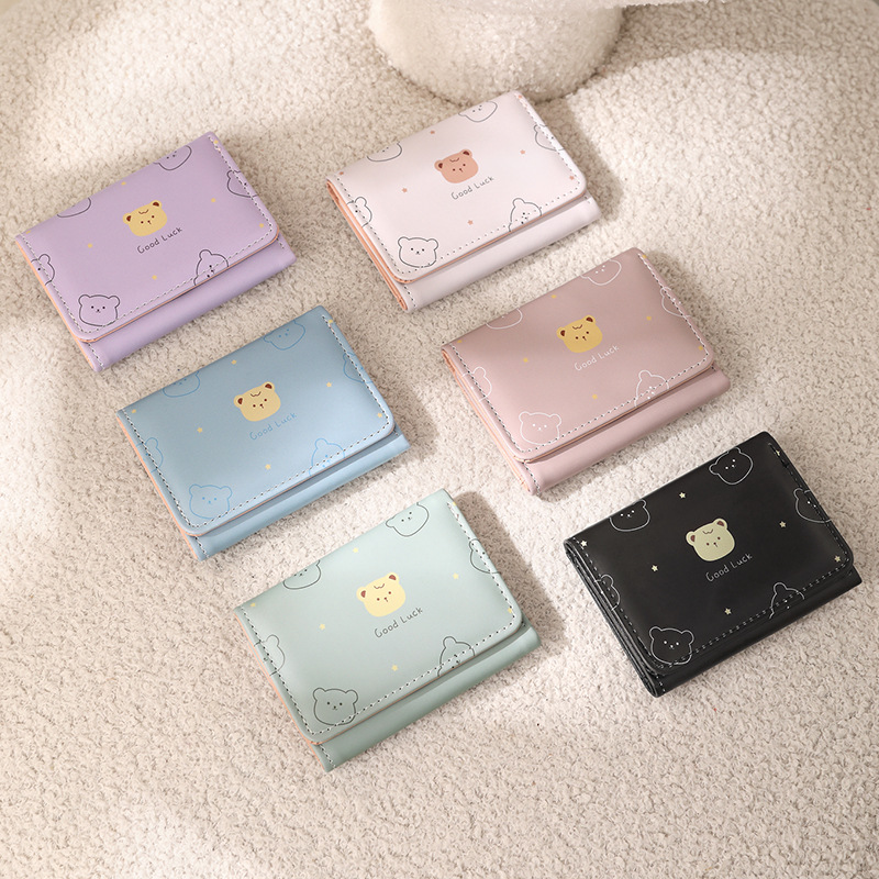 Bolso de mujer nuevo versátil fresco estilo japonés cartera animada corta tres plegables estudiantes impresión cartera plegable de dibujos animados