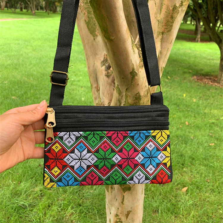 Riñonera bordada étnica de Yunnan con tres cremalleras, diseño artesanal tradicional