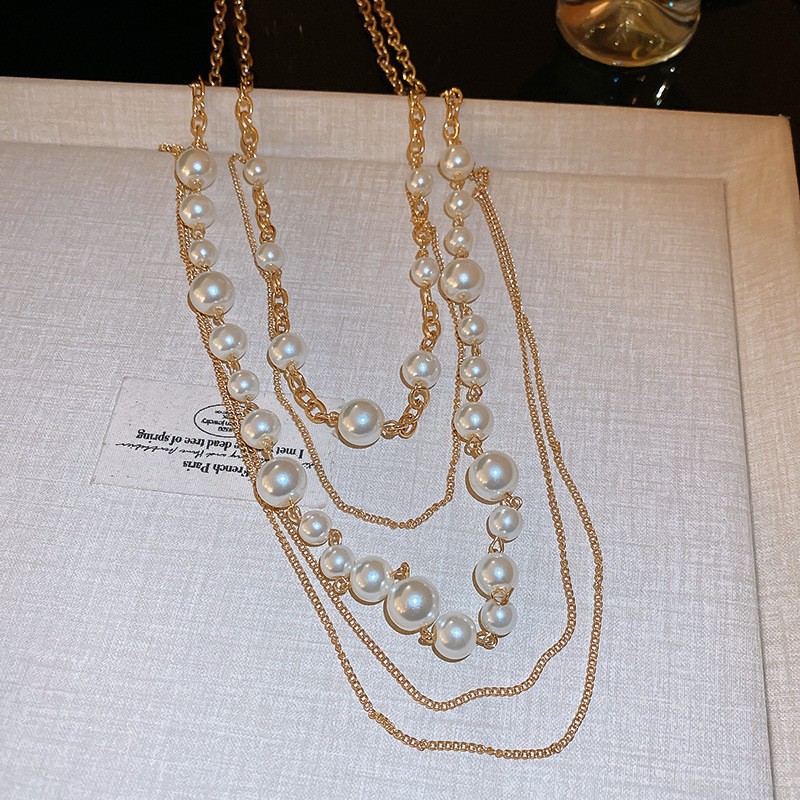 Collar con cuentas de perlas de gota de agua con diamantes transfronterizos otoño e invierno cadena de suéter de lujo ligero francés moda todo fósforo joyería de alta gama