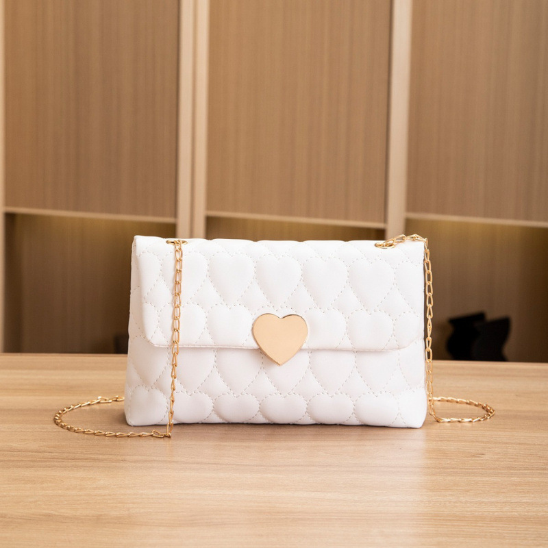 Bolsa de hombro de cerradura de corazón de melocotón comercio exterior al por mayor 2025 primavera y verano nuevo bolso multifuncional de mujer, bolso de mujer interior