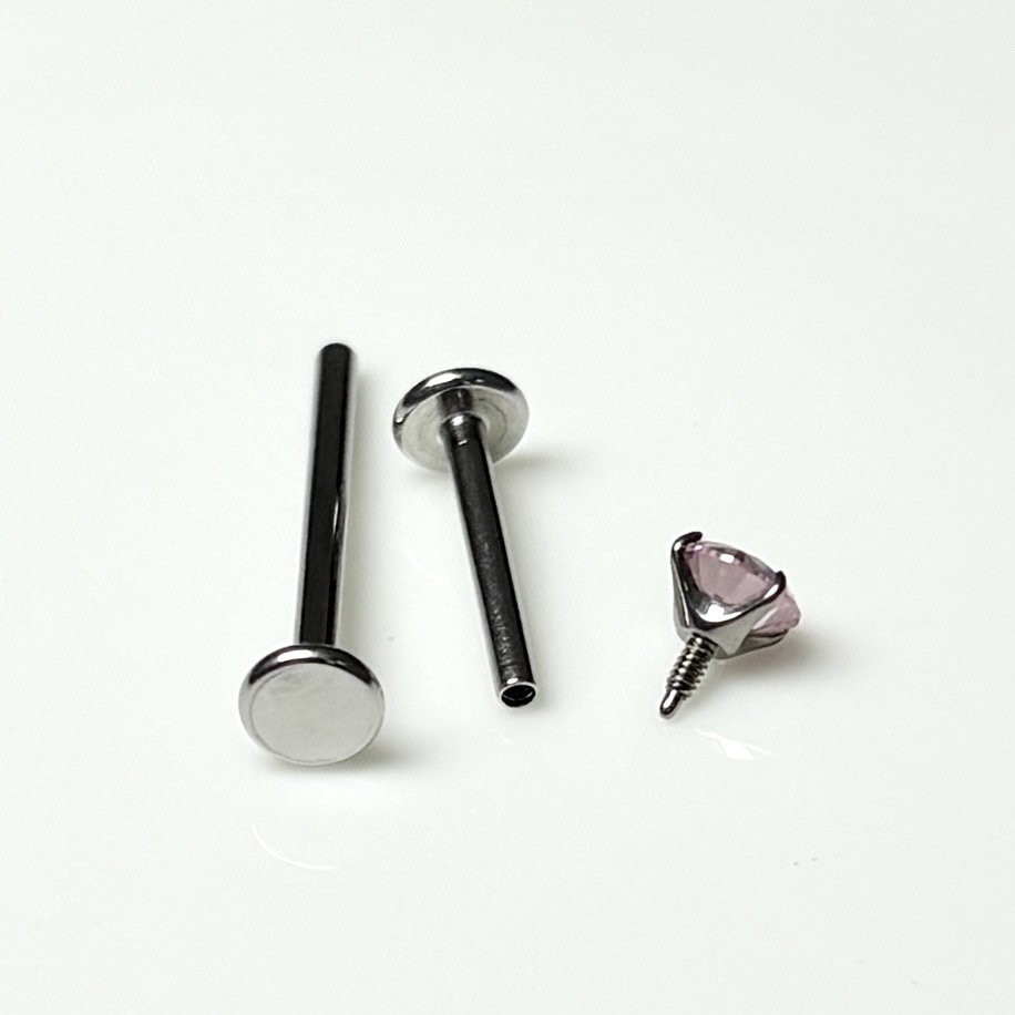 Silver pointed spike labret stud material detail
