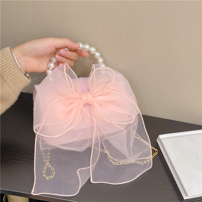 Moda estilo occidental bowknot hombro mensajero bolso lindo bebé monedero todo-Partido mini chica pequeña bolsa