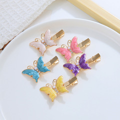 Korean version of the small Chanel-style colored pearl butterfly hair clip, new oil drop animal side part hair clip, side hair accessory hair decoration