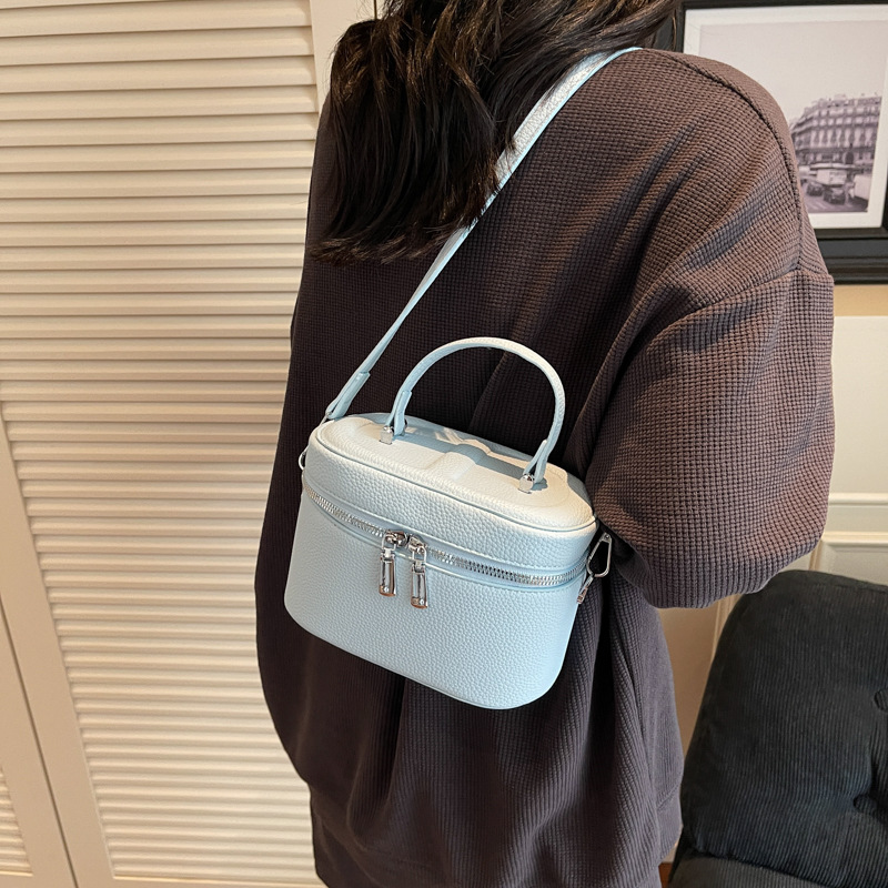 Bolso de cubo popular de este año 2025 verano nuevo bolso de hombro con patrón de lichi bolso de mensajero simple y versátil mujer