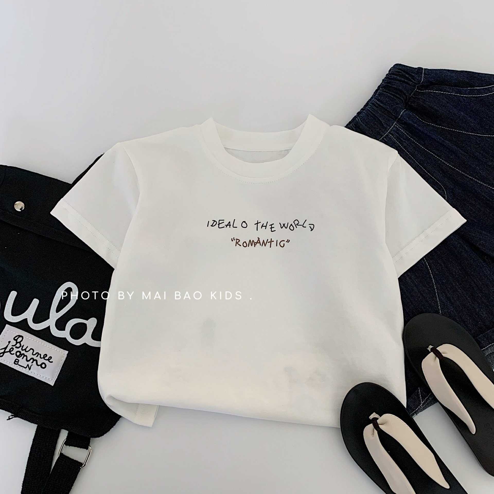 Camiseta de manga corta de verano para niños Maibao 2025 nueva versión coreana de las letras de los niños de algodón puro a verano Huzhou Zhili marea