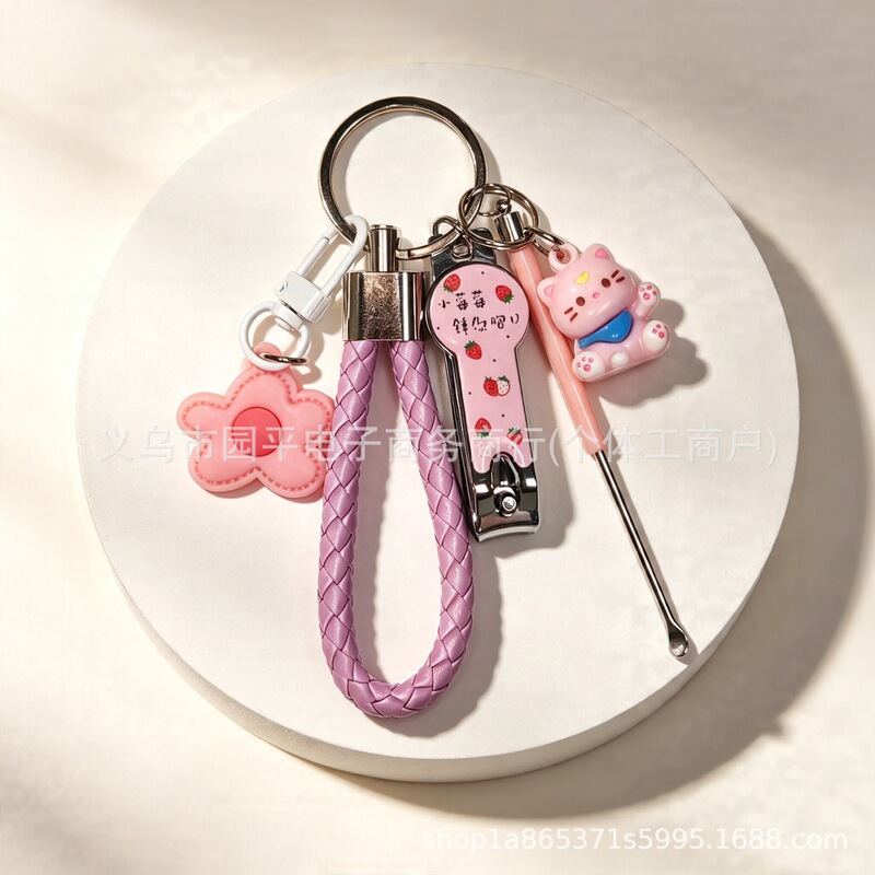 Cute and colorful floral keychain, nail clipper, and ear pick set, perfect as a backpack charm or accessory for girls' bags Cute and colorful floral keychain, nail clipper, and ear pick set, perfect as a backpack charm or accessory for girls' bags