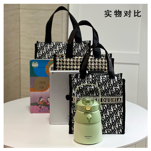 New Korean version is portable large-capacity hand-carrying commuter lunch box bag document tutoring bag mommy bag toiletry bag