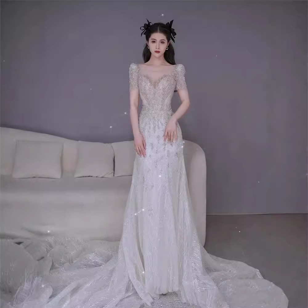 Nuevo vestido de novia estilo sirena francés 2026 con cola para bodas transfronterizas, con una elegancia súper mágica para la novia.