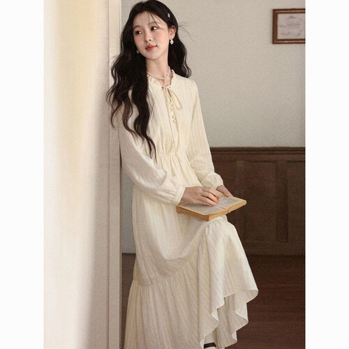 A women's autumn new style V-neck long-sleeved French-style apricot dress with 
