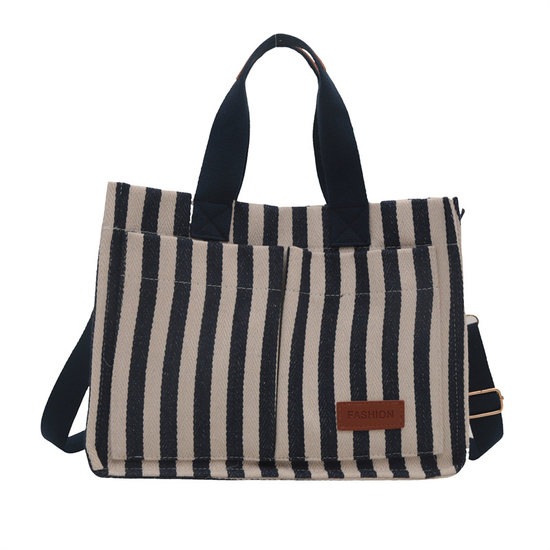 Bolsas de gran capacidad de transporte 2024 nuevas bolsas de mujer populares bolsas de lona a rayas bolsas de mochilas de moda bolsas de mano
