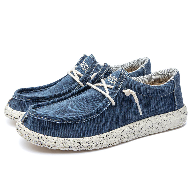 2025 al por mayor de primavera de mediana edad nuevos zapatos casuales de hombre zapatos de tela transpirables zapatos de lona PU ligeros zapatos de pedaleos