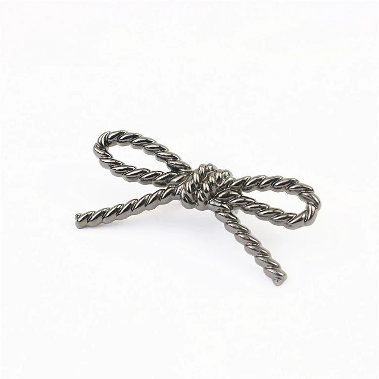 Metal bag accessory with pigtail, footwear buckle with bow, shoes, decorations